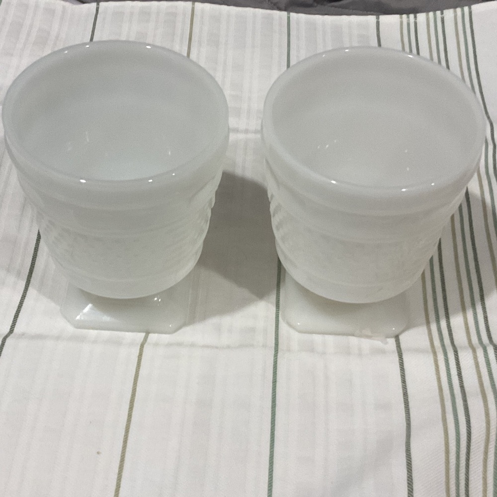 Elegant White milk glass candy dishes or plant holders.Get both made by Napco.